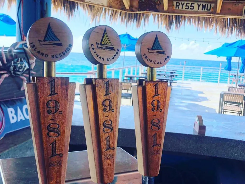 1981 craft beer taps with ocean view, Grand Cayman.