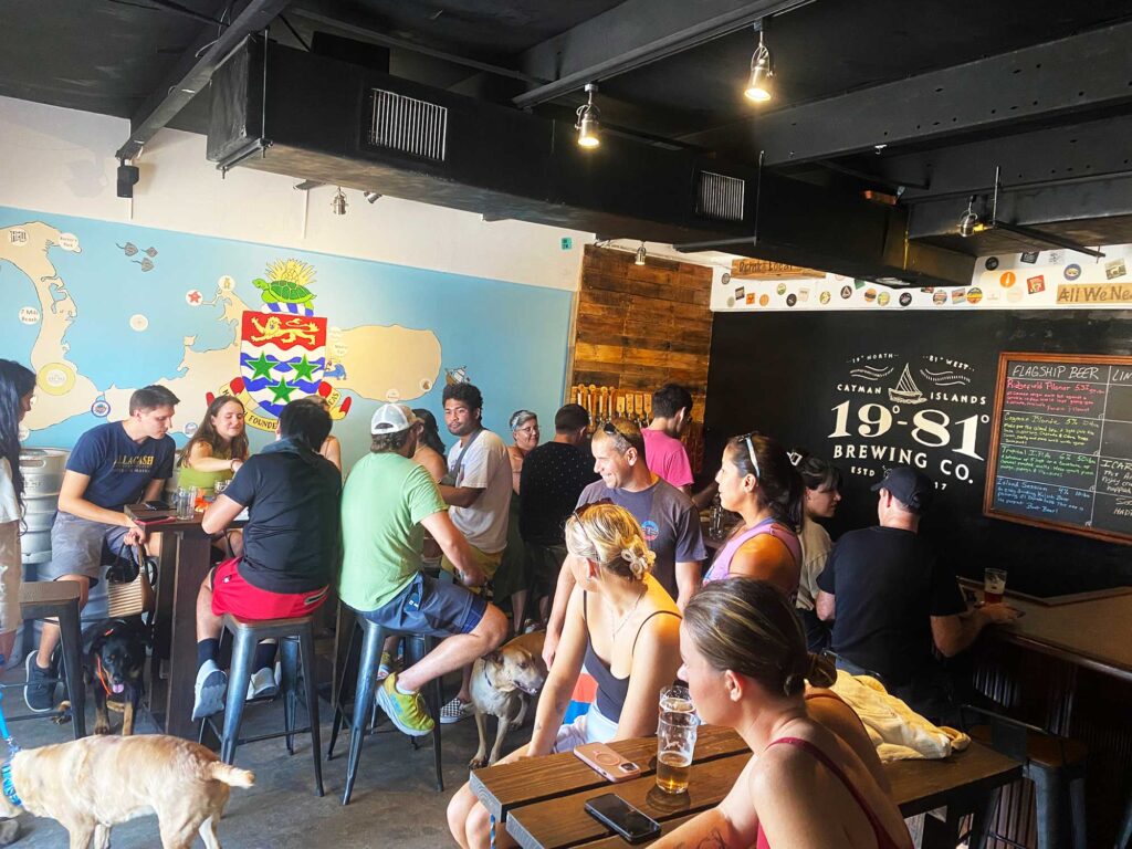 Locals & dogs enjoy craft beer at 1981 Brewing Co. in the Cayman Islands.